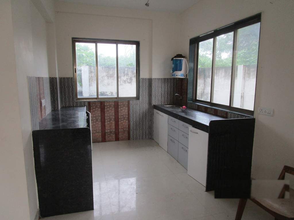 Fitted kitchen with twin windows