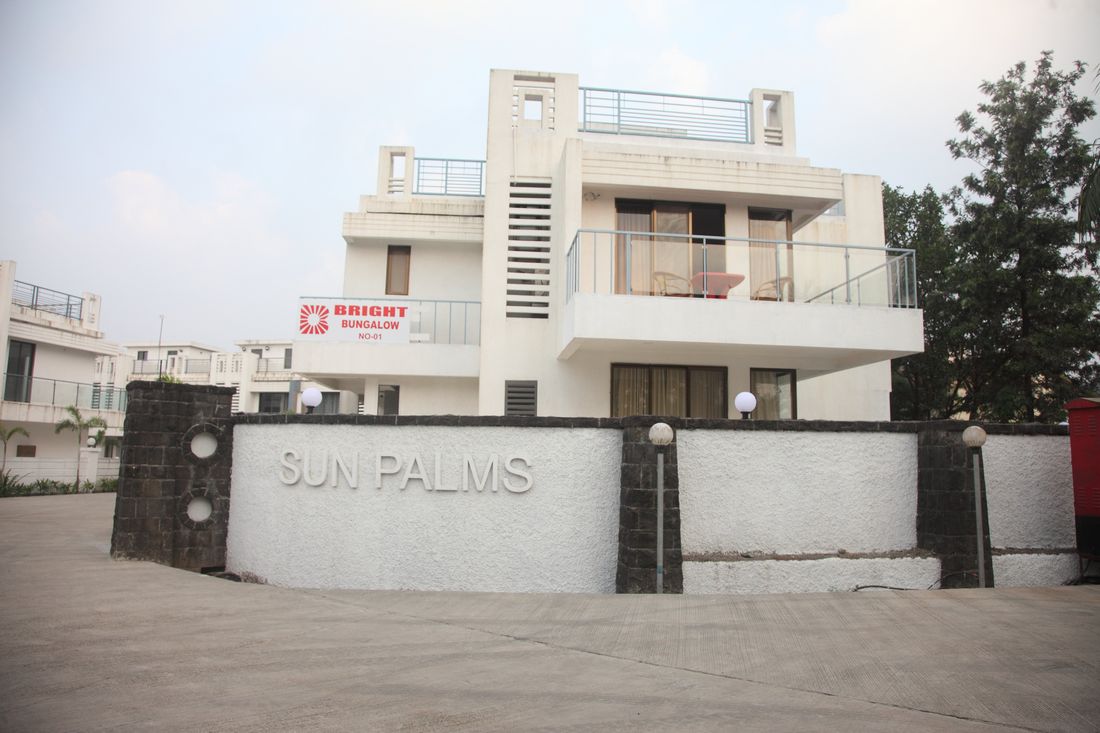 Sun Palms entrance wall and villa frontage